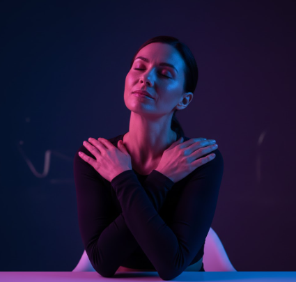 Woman relaxing her shoulders as part of a recovery routine